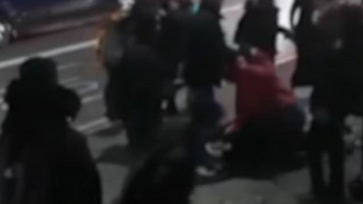 Moment woman pins schoolgirl down on the pavement after bus argument
