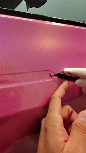 Trimming a Tesla model 3’s door handle 🔪 #teslamodel3 #vinylwrap #carwrap #pinktesla #CapCut