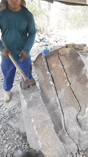 Stone Splitting Techniques by Construction Worker