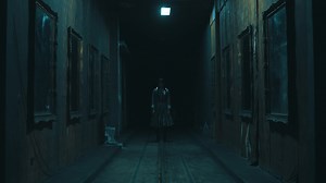 Creepy dark hallway with a ghostly figure at the end, horror scene concept.