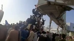 Afghans desperately try to board plane at Kabul airport to flee Afghanistan