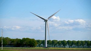 Lelystad, The Netherlands, Modern windmill generation power at a Dutch landscape Stock Video