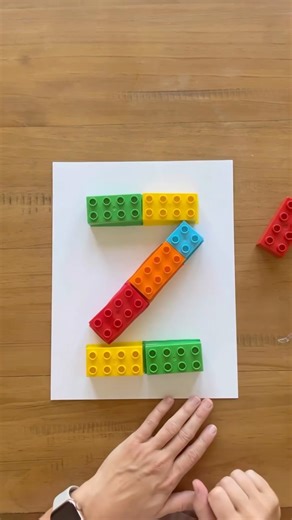 Lindsey BenGera | Sprinkle in Learning® on Instagram: "Lego Letters ✨ Here’s a fun, hands-on way to strengthen little fingers while laying the foundation for early literacy. Build fine motor skills, hand-eye coordination, and letter recognition all at once. Comment ‘lego’ to download this free activity! Have fun! 🤩 #sprinkleinlearning #legos #legosarelife #ela #alphabet #learningthroughplay #handsonplay #handsonlearning #preschoollearning #finemotorskills #letterrecognition #handeyecoordination