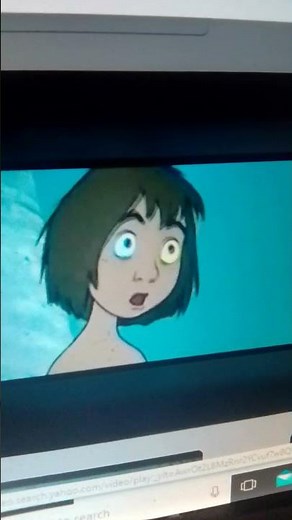 Kaa the snake hypnotized wrapped up squeezing coils Mowgli from The Jungle Book