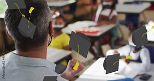 Animation of graduation cap icons over diverse schoolchildren and teacher wearing face masks