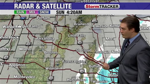 Light snow slowly sliding out of central Minnesota this morning