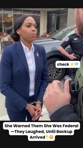 She Warned Them She Was Federal—They Laughed, Until Backup Arrived 😱 Cole’s laugh cut off when Regina’s voice rose above the crowd—even his quiet authority sounded small next to hers. “You have no warrant,” she said, louder now. “You are detaining a federal official without cause.” Henkins glanced from Cole to the cuffs on her wrists, measuring them like an awkward burden. “You talk a big game,” he muttered, “for someone in handcuffs.” A woman at the nearby café was already recording on her pho