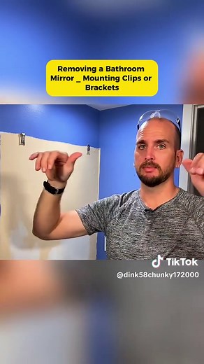 Removing a Bathroom Mirror Using Clips and Brackets