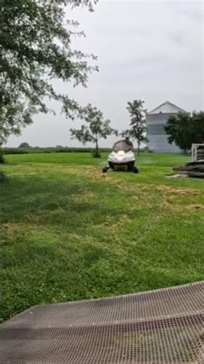 Riding a Snowmobile in the Middle of Summer - Not Normal on an Iowa Farm