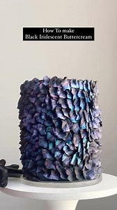 How to make Iridescent Buttercream 1. Start with different colors of buttercream. I wanted to make black iridescence, so I went for black with steaks of pink, teal and blue. Use white buttercream for a pearly iridescence #funkybattercream 2. Use a Large Leaf tip (any brand) and pipe overlapping leaves to make almost a dragon-scale pattern. I like to keep moving my piping bag around to get different shades and colors 3. After chilling the cake in the refrigerator, I dry dusted it with some Irides