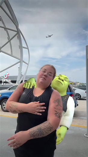 Hes bouncing off my booty cheeks. Peep the airplane in the back. #atlbound#fyp#fypシ#airportlife#atlantaairport#shrek