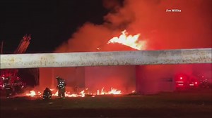 Debris from commercial building fire falls, injures Dallas firefighter