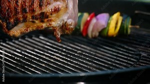flips the meat on the grill, steak and vegetable on the grill slow motion, grilled meat and vegetables slow motion