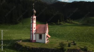 Rotated view of a small cherch in a small village in Dolomites Italy.