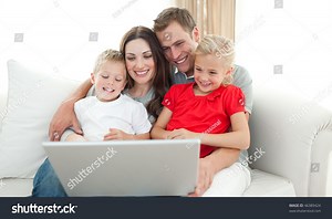 Joyful Family Using Computer Sitting On Stock Photo 46389424 | Shutterstock