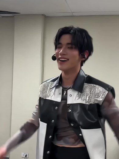 Dynamic Dance Performance with Metallic Jacket