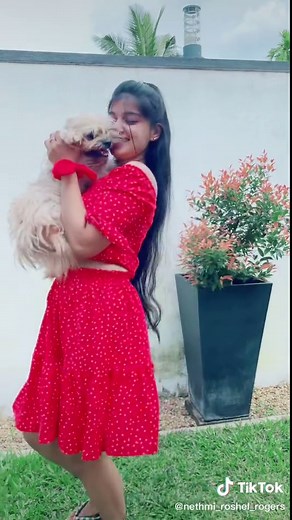 Adorable Moments with a Young Woman and Her Fluffy Dog