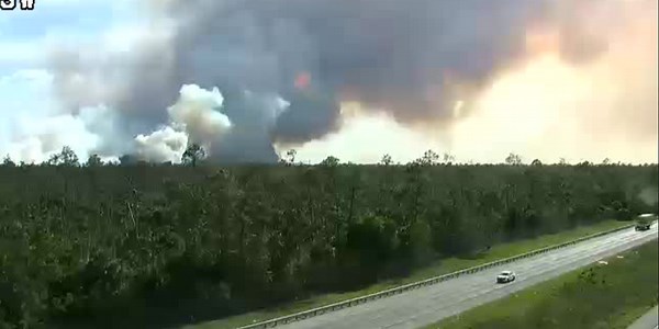Evacuations remain as brush fire expands near major Florida interstate