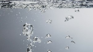 Premium stock video - Underwater view of water bubbles in clean water