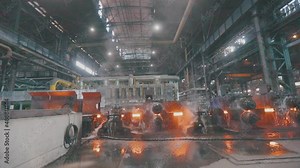 Metal production process in a metallurgical factory. Red hot metal in a modern factory. Modern metallurgical factory