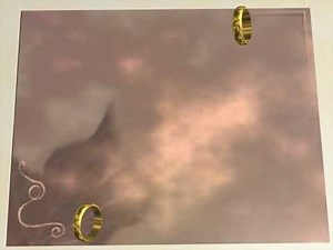 Two wedding rings rotate on the sides of the background