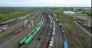 Freight trains at the station aerial view. Top-down view of freight trains at the railway depot. Freight trains at the depot view from the drone.