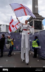 London, UK.  22 April 2017.  Flag dancers on stilts prepare to entertain people gathered in Trafalgar Square to celebrate the Feast of St. George, hosted by Sadiq Khan, Mayor of London, to celebrate St. George's Day. Credit: Stephen Chung / Alamy Live News Stock Photo - Alamy