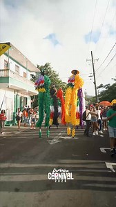Bwa Bwa stilt walkers glide through the streets, guarding the vibes of Mas Domnik and bringing Dominica’s Real Mas spirit to life in every parade and promotion. 🎥: @soisgenial.mm #DominicaFestivals #MasDomnik2026 #DominicaCarnival #TheRealMas2026 #TheRealMas | Dominica Festivals