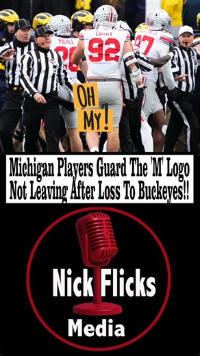 Michigan Players Guard The 'M' Logo Not Leaving After Loss To Buckeyes! ___________________ Several minutes after the final horn sounded in No. 1 Ohio State’s 27–9 win over rival No. 15 Michigan on Saturday at The Big House, Wolverines players stood at midfield to guard their “M” logo. “Gus, Michigan hasn’t left the field,” Fox Sports analyst Joel Klatt said to play-by-play announcer Gus Johnson on the television broadcast. “They’re guarding the ‘M’ as Ohio State sits with their fans.” #sports #