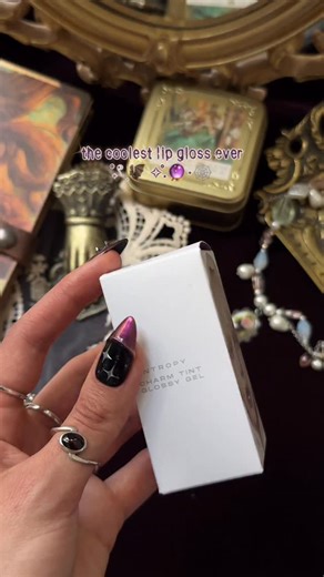 𓁹 G O L D I F F I C 𓁹 on Instagram: "@entropy.global Charm Tint Glossy Gel in Taaffeite Charm 🔮 One of the coolest and most edgy lip products I own! And that key ring cap is metal😳 It has such a hydrating formula, ultra-glossy, mirror-like gel texture. You can easily build it up, give it more opacity, but it will require touch-ups, as it’s not that ultra long wear. Honestly impressed by how dewy it makes your lips and I highly recommend it for those of you who want a more elevated and intere