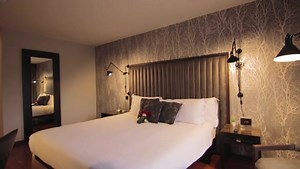 Guests are treated to a little extra luxury in our sumptuously stylish Luxury Suites at The Twelve, making them perfect for couples on a romantic getaway or for those who like to entertain. 🎵 🥂 Our Luxury Suites feature a separate opulent living space, super king size bed, moody lighting, your own private bar and record player with a specially curated vinyl collection, and a vibe. | The Twelve Hotel