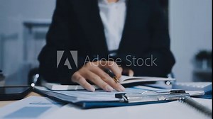 Asian accountant working and analyzing financial reports project accounting with chart graph in modern office, finance and business concept.