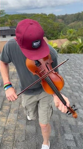 Fiddling “Fiddler on the Roof” on a roof in Hawaii.