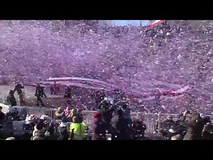 Confetti falls as American flag parades by in Plymouth Thanksgiving celebration