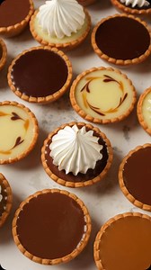 Amaze your guests at your next party with stunning Mini Tarts Assorties! These bite-sized treats, crafted by Yevhenii Ivanets (@ivanetspastry), are not only simple to make but utterly delicious and incredibly charming. They’re sure to leave no one untouched! 💗 📚🎉 Dive into “The Mini Cakes Collection” e-book and discover 12 adorable recipes that will make any celebration extra special: 1. Mango & Passion Fruit Cloud 2. Raspberry Cloud 3. Chocolate Volcano Mini Cakes 4. Blackcurrant Moelleux 5.