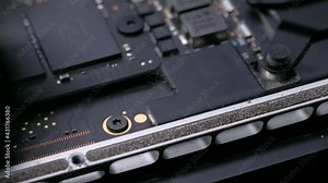 Computer Service. Master cleans the inside of the laptop with dust and other dirt. 4k. Close up. Tech Support Electronic Devices Concept.