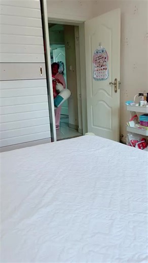 Traditional Baby Outfit and Unicorn Toy Interaction