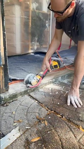 Using the hydro tail to keep concrete dust down.