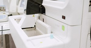 Blood chemistry analyser machine. Hemostasis analyzer machine in clinic laboratory. Professional medical equipment in modern lab.