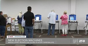 Local election officials demonstrating new 'hybrid' voting machines