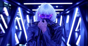 Woman in a neon room. Cyberpunk fashion.