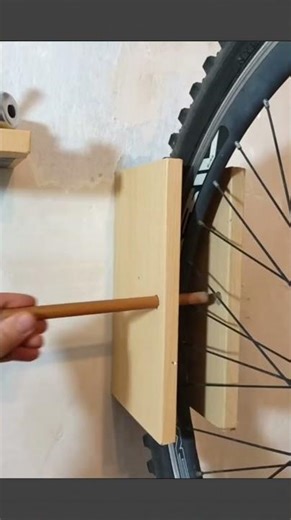 Brilliant DIY idea to make a bike hanger and save space in your home garage #bikestorage #DIYideas