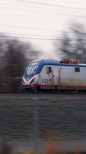 A pair of ACS-64 locomotives bookend a mix of Amfleet cars on an Amtrak train at Morrisville, Pennsylvania. Do you go out to take photos when the weather is dreary, or do you prefer sunny days? | Trainiac Productions
