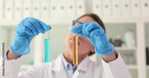 Scientist shows test tubes for testing toxic liquids. One test and two results and the right choice