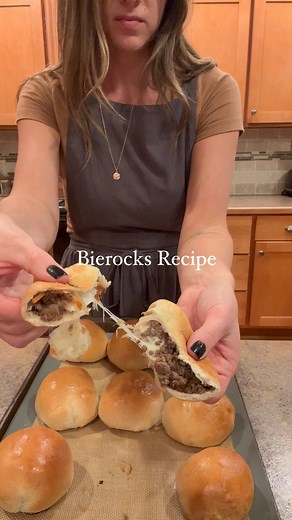 Jess Toevs on Instagram: "If you don’t have time to make your own dough, this recipe is for you! My quick bierock Recipe: Set out 18 frozen Rhodes brand dinner rolls in a bag and place in the fridge overnight to thaw. Brown 1 lb. Ground beef in a skillet, drain, and place back in the pan. Add half a bag of tricolor coleslaw (green and purple cabbage and carrots), cook a few minutes until wilted down. Add onion and garlic powder, pepper and salt- I don’t measure. Add about 4-6 Tbsp soy sauce. Mix