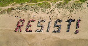 Protesters spell "resist" on San Francisco, Pacifica beaches