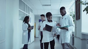 Medical students converse in the hall - Free Stock Video