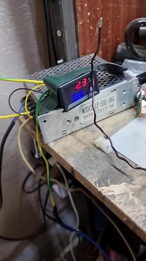 Close-Up Electronic Setup on Wooden Workbench