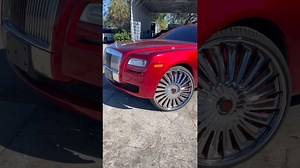 Candy red Rolls-Royce Ghost on 28’s DUB skates