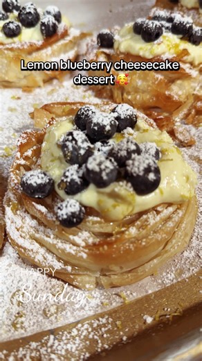 Craved something sweet tonight INGREDIENTS 1 16-ounce box phyllo dough 2 sticks butter melted (1 cup) 5 whole eggs 1 cup granulated sugar 2 teaspoons vanilla extract Zest from two lemons 2 1/2 cups Crème Fraiche 1 cup fresh blueberries INSTRUCTIONS 1. Preheat oven to 375 degrees F. 2. Line a baking sheet with parchment paper 3. Lay out a single piece of phyllo and brush with melted butter. Place a second piece over and press the two together. 4. Fold like an accordion the long way. Then take thi